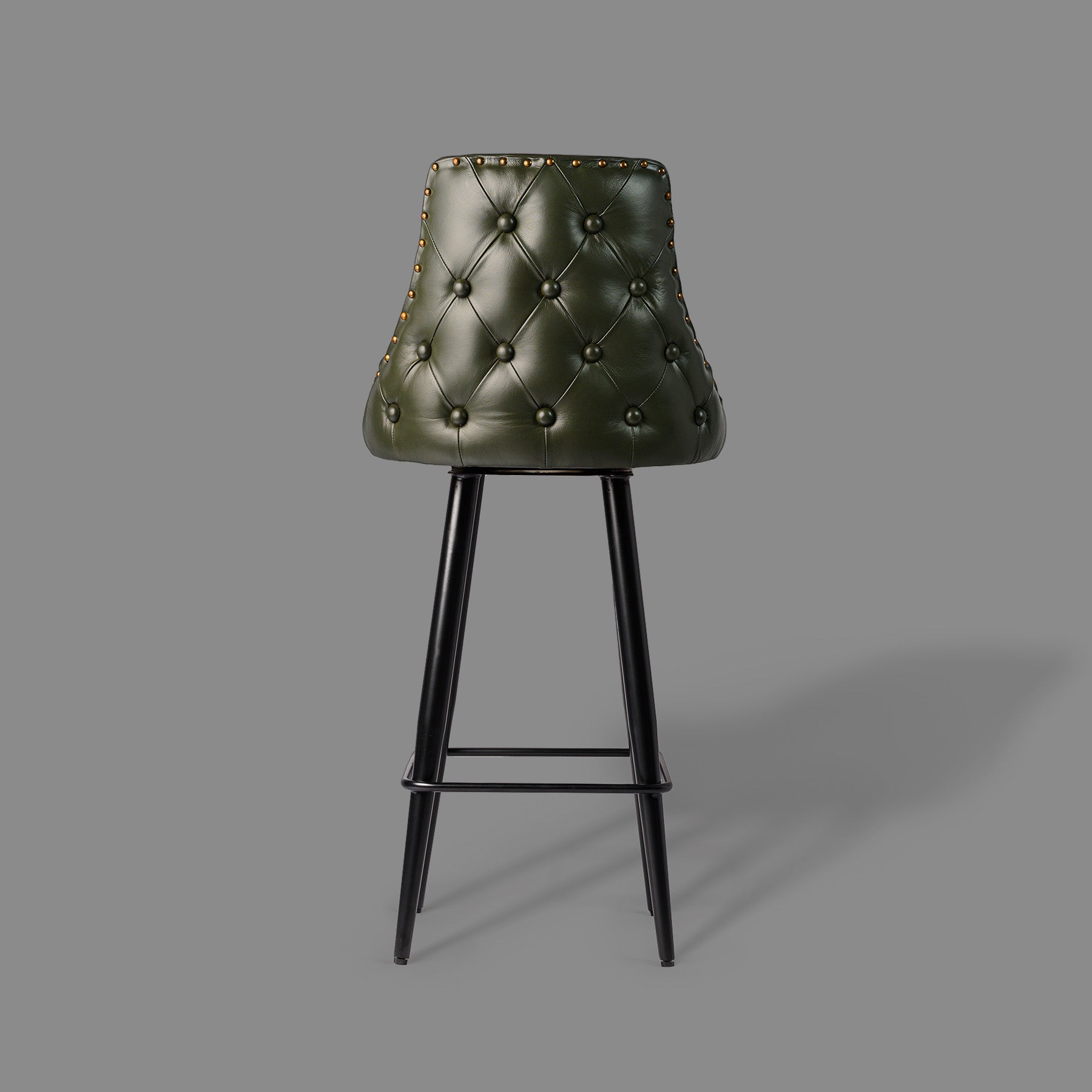 Green bar stool with tufted backrest