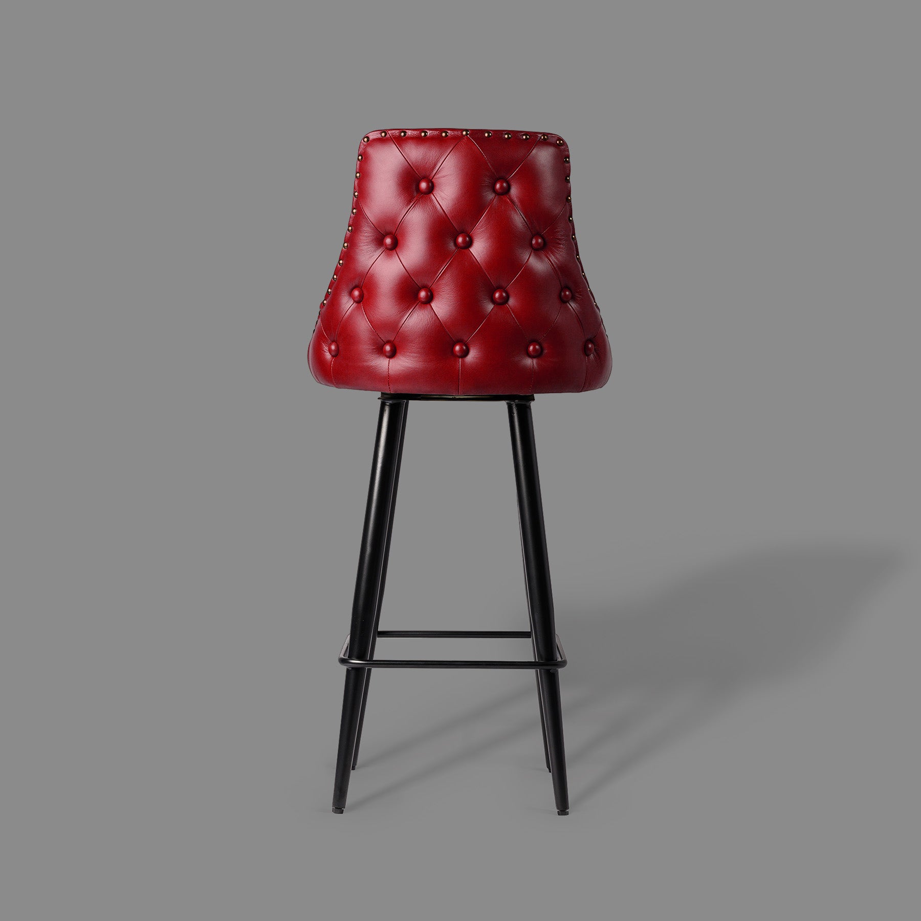 Red bar stool with black legs